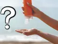 Mano che versa crema solare, ma è scaduta? Grande punto interrogativo sulla protezione solare.