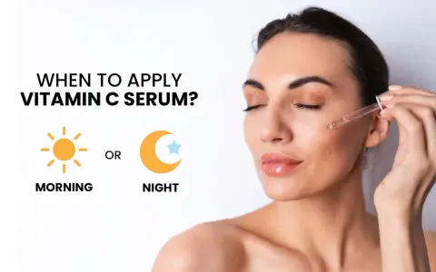 Donna applica siero vitamina C: quando usarlo? Mattina o sera per una pelle luminosa.