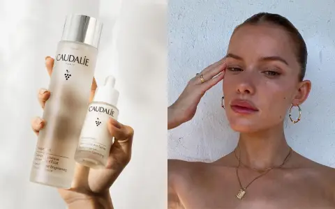 Come applicare il siero viso Caudalie per una pelle radiosa. La mano tiene due flaconi del prodotto, uno più grande e uno con contagocce.