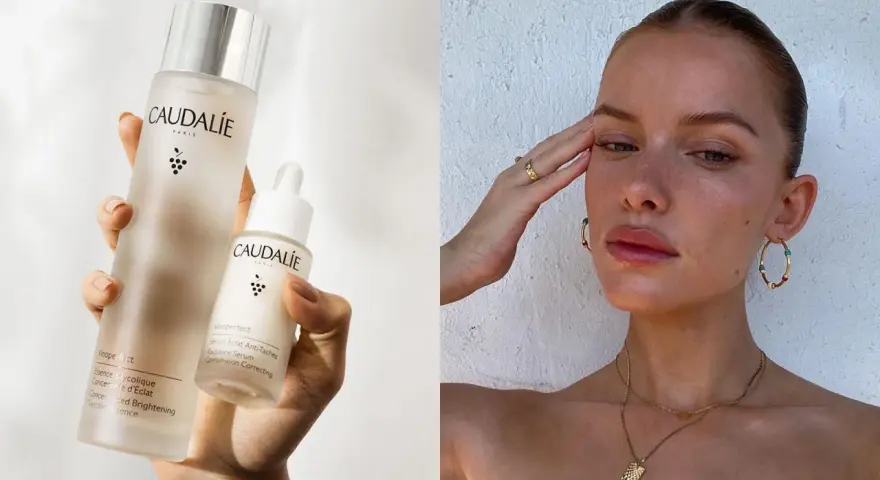 Come applicare il siero viso Caudalie per una pelle radiosa. La mano tiene due flaconi del prodotto, uno più grande e uno con contagocce.