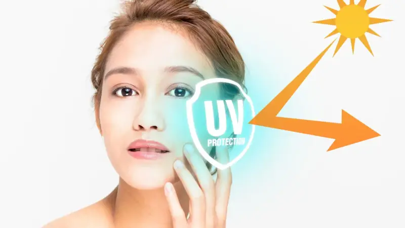 Volto di donna con simbolo di protezione UV e sole. La cura della pelle è fondamentale per ogni fototipo.